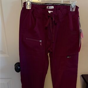 koi Lite Peace Women's 6-Pocket Stretch Scrub Pants Wine. Size XXS Regular. NWT.
